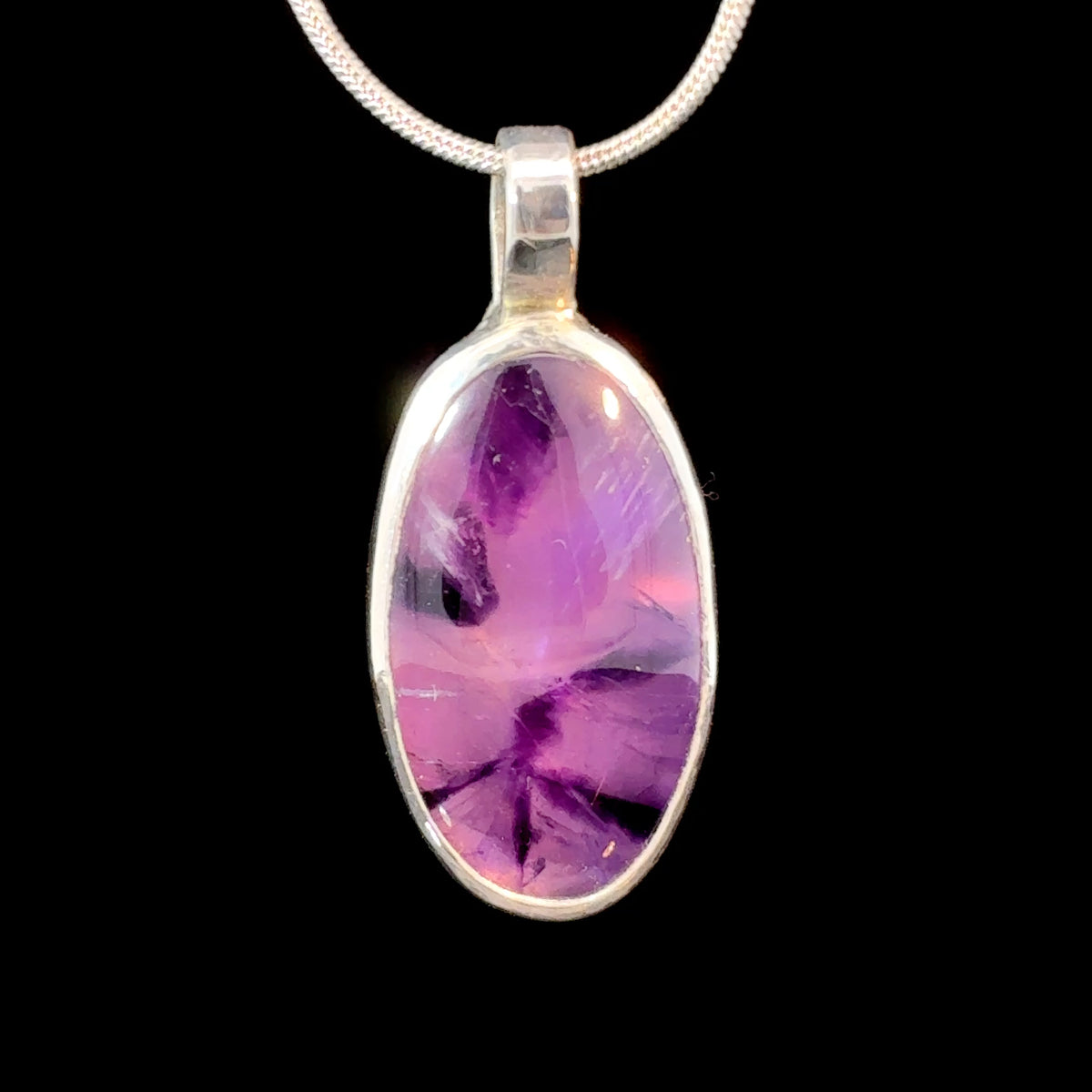 Trapiche Amethyst oval cabochon set in sterling silver, 6.2 grams, measuring 35 x 15 mm