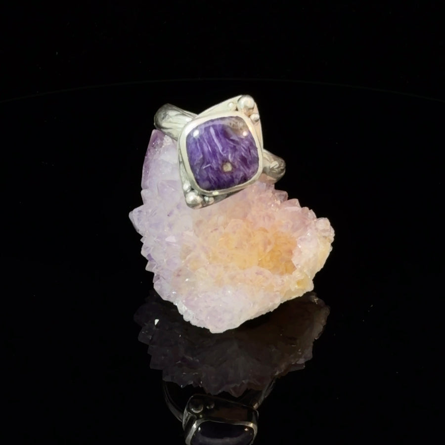 Handcrafted sterling silver ring with natural square Charoite gemstone, silver bead accents, and floral detailed band, size 9.