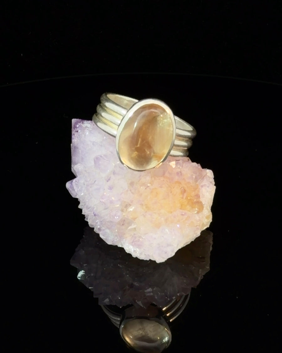 Natural Oregon Sunstone oval bezel set sterling silver solitaire ring with ribbed band design, size 8.5, handcrafted gemstone jewelry.
