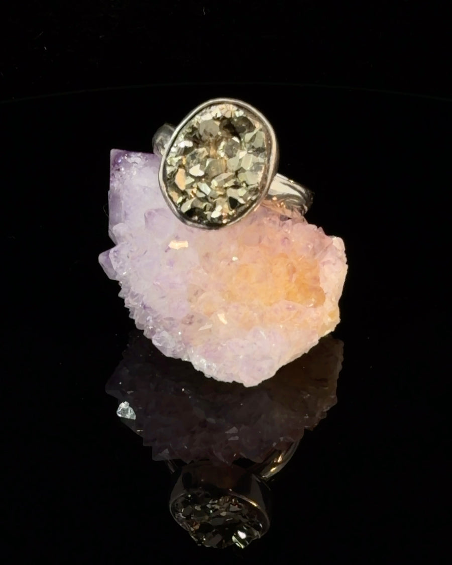 Handcrafted sterling silver ring featuring a natural raw Pyrite crystal in a smooth bezel setting, showcasing the metallic gold texture of the mineral, Size 9.