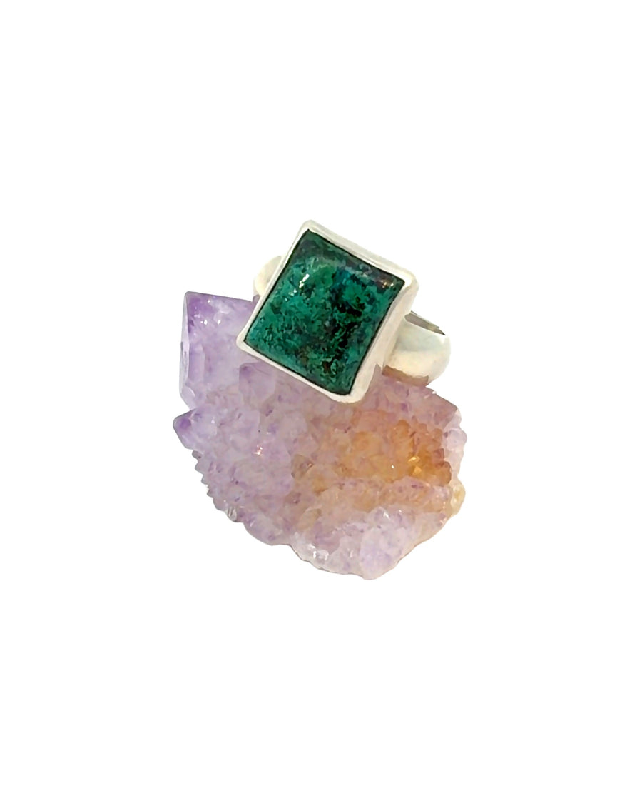 a handcrafted sterling silver Chrysocolla ring featuring a natural blue-green gemstone in a sleek bezel setting. Size 9