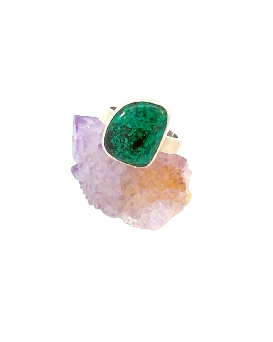 Natural freeform Chrysocolla adjustable sterling silver ring with blue and green gemstone in a polished bezel setting.