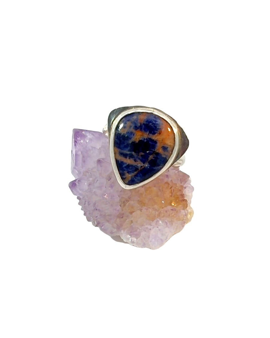 Natural Sodalite ring in sterling silver featuring a bold bezel-set blue gemstone with earthy matrix patterns. Size 8.5.