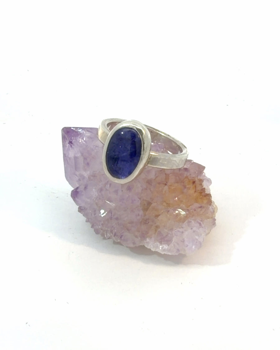Natural deep blue-violet oval Tanzanite cabochon bezel set in a sterling silver solitaire ring, Size 6.