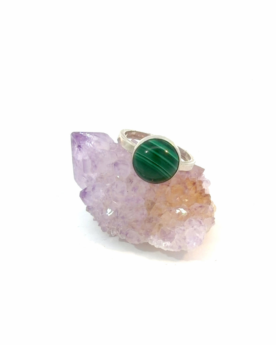 Natural Malachite sterling silver ring with a bezel-set round cabochon displaying vivid green banding, handcrafted in a minimalist design, size 5.
