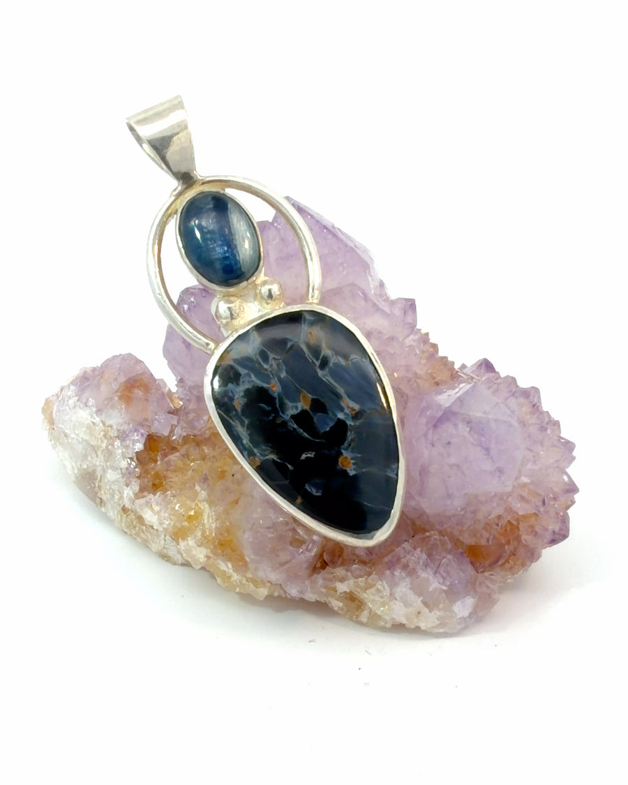 Natural Pietersite and Kyanite sterling silver pendant featuring deep blue bezel-set gemstones and artisan handcrafted design.