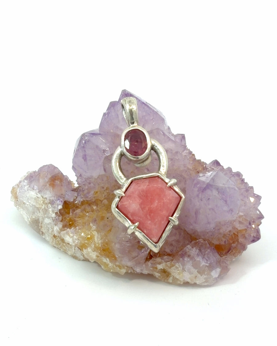 One-of-a-kind sterling silver pendant featuring a natural red ruby above a geometric-cut rhodochrosite gemstone in a contemporary two-stone design.