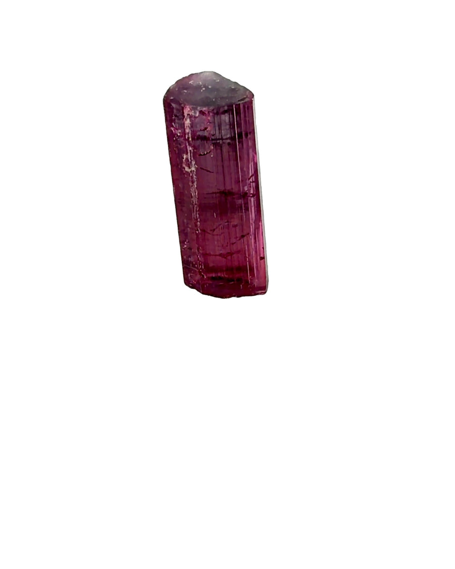 Natural raw purplish red Tourmaline crystal with vertical striations mounted on a clear acrylic display base.