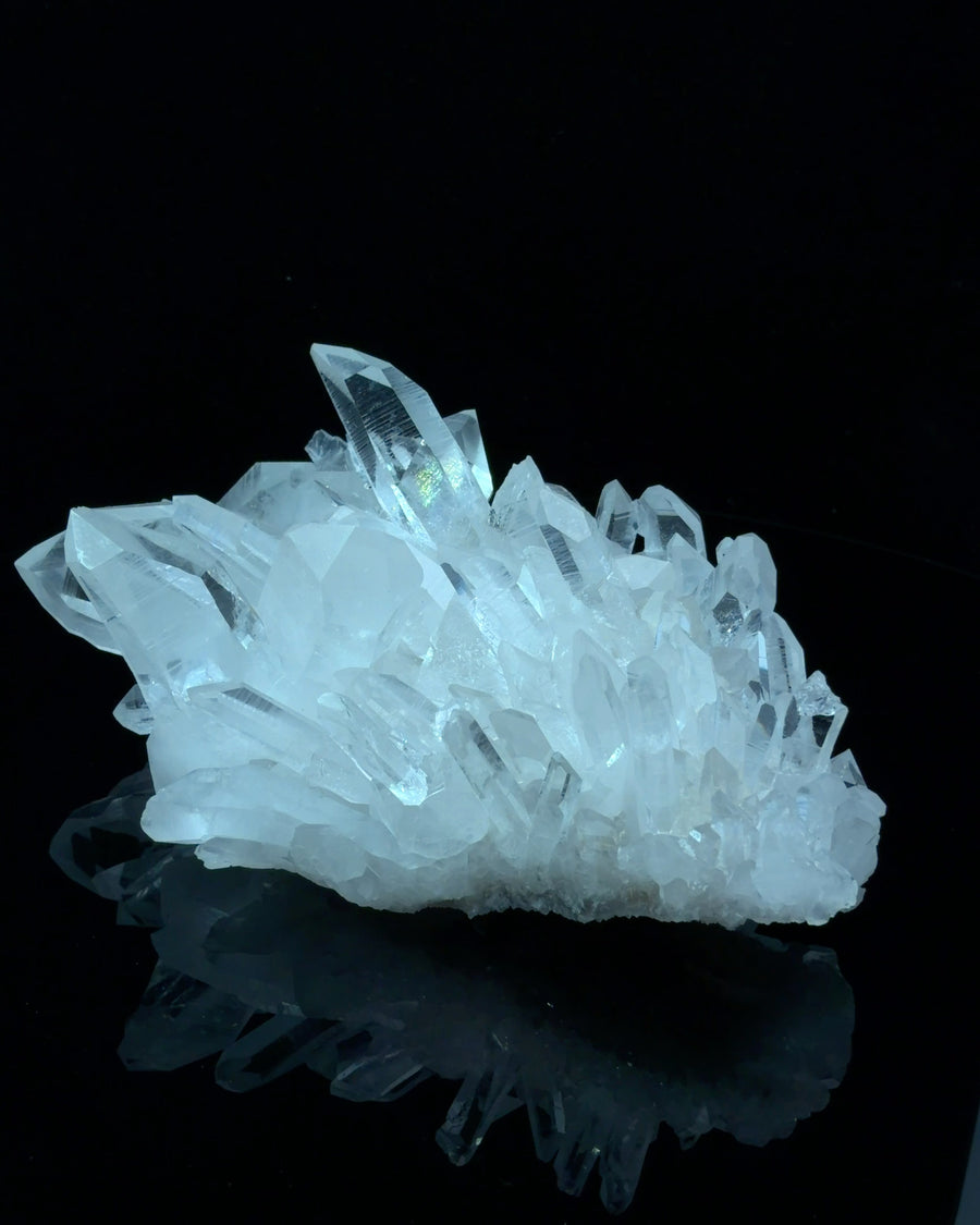 Natural clear quartz crystal cluster with multiple terminated points, raw mineral specimen measuring 9.7 x 6.2 x 3.9 cm