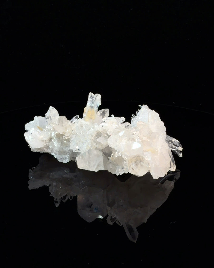 Natural Arkansas clear quartz crystal cluster with multiple transparent and milky points, raw mineral specimen measuring 6.7 x 6.1 x 2.9 cm
