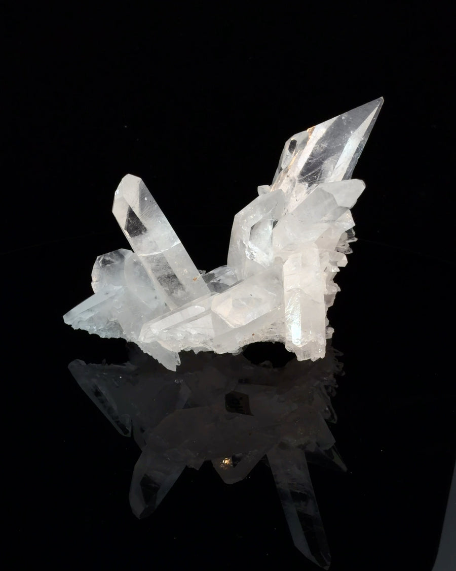 Natural Arkansas clear quartz crystal cluster with multiple terminated points, measuring 7.4 x 5.9 x 5.1 cm