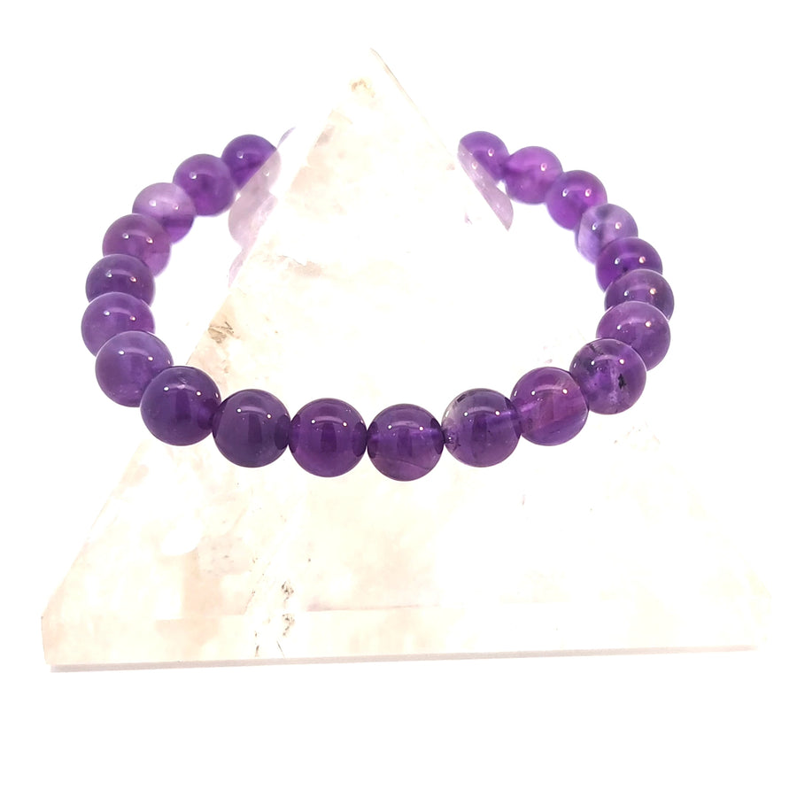 Natural Amethyst stretch bracelet featuring genuine deep purple beads.