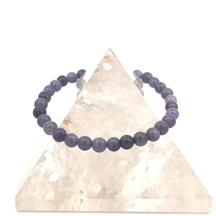 Natural Iolite bead stretch bracelet with purple and blue gemstone beads on elastic cord.
