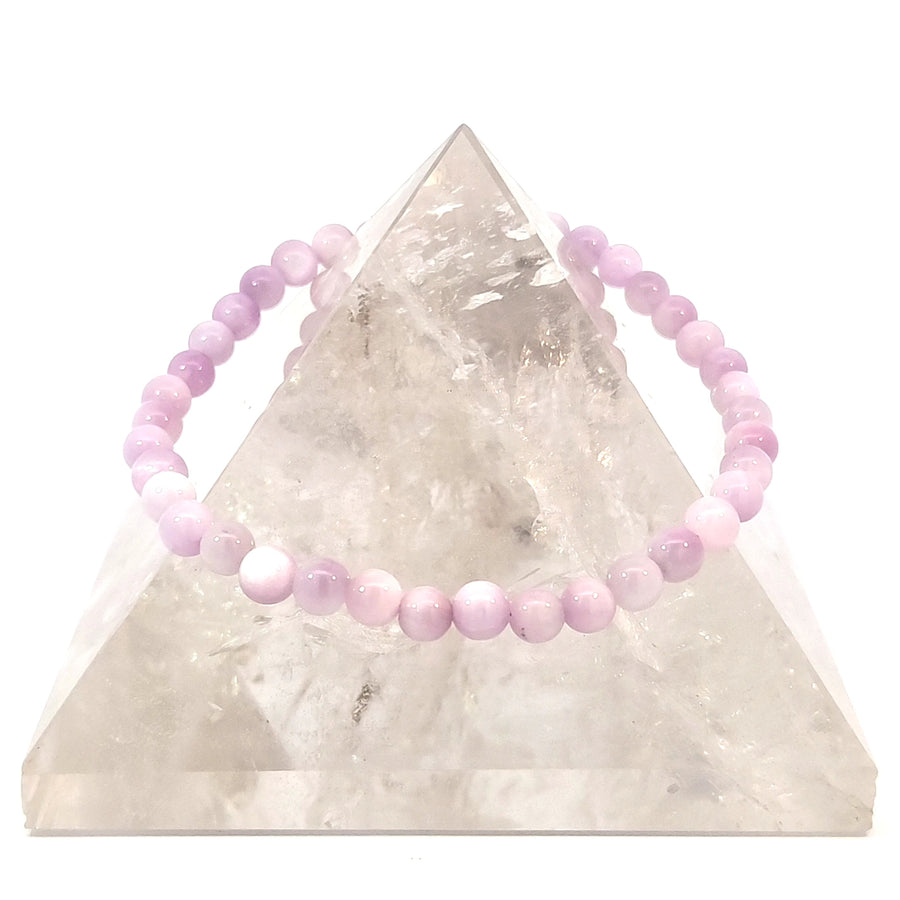 Natural pink Kunzite stretch bracelet made with genuine gemstone beads on elastic cord for emotional healing, love, peace, and everyday crystal jewelry.