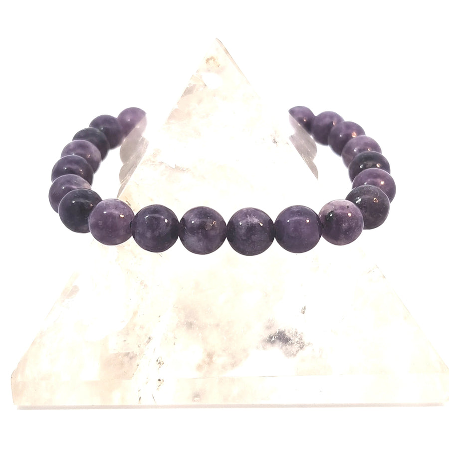 a natural Lepidolite stretch bracelet featuring polished purple gemstone beads.
