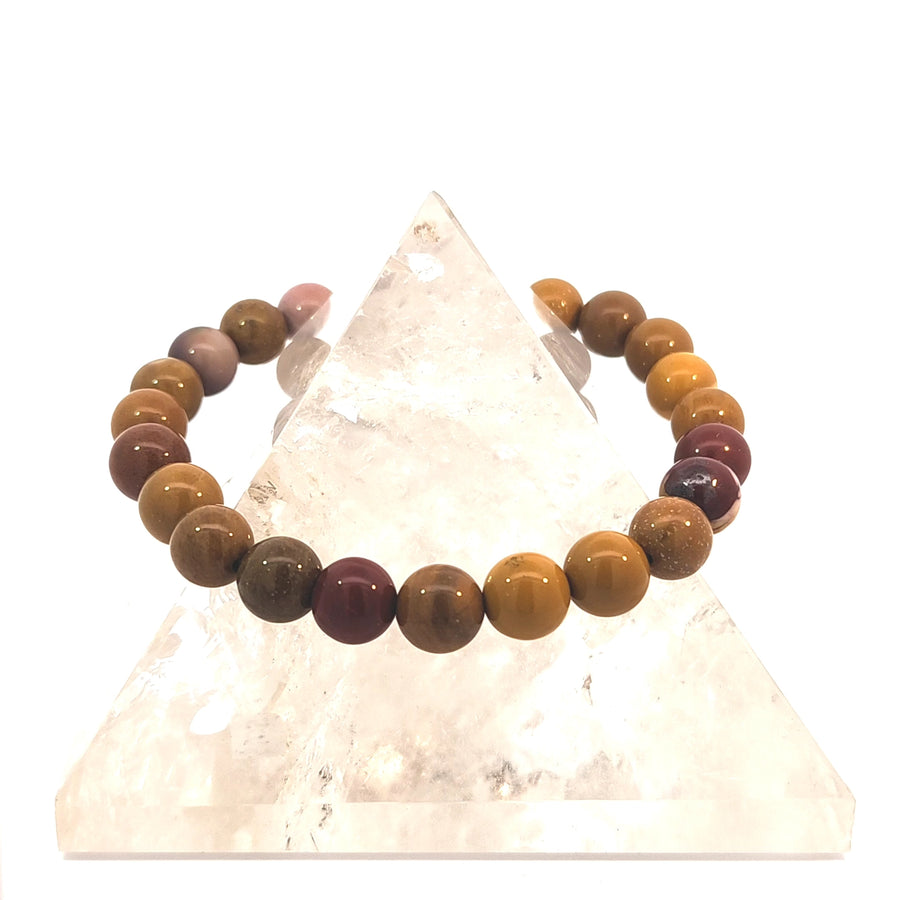 Natural Mookaite Jasper stretch bracelet with polished Australian gemstone beads in red, gold, cream, and burgundy colors.
