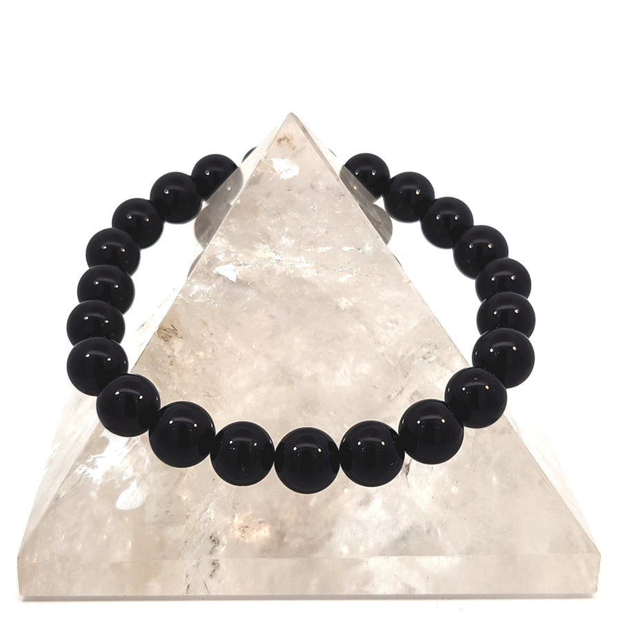Natural Black Onyx stretch bracelet with polished black gemstone beads on durable elastic for small to medium wrists.
