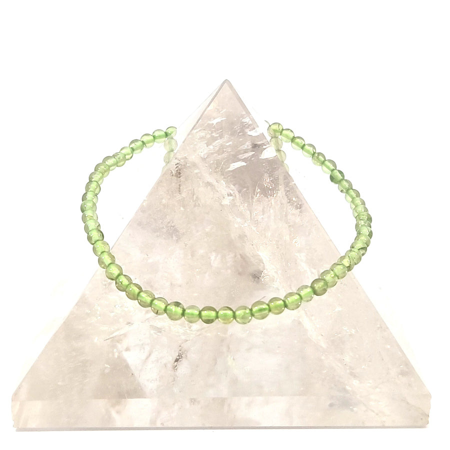 natural peridot stretch bracelet with vibrant green gemstone beads.