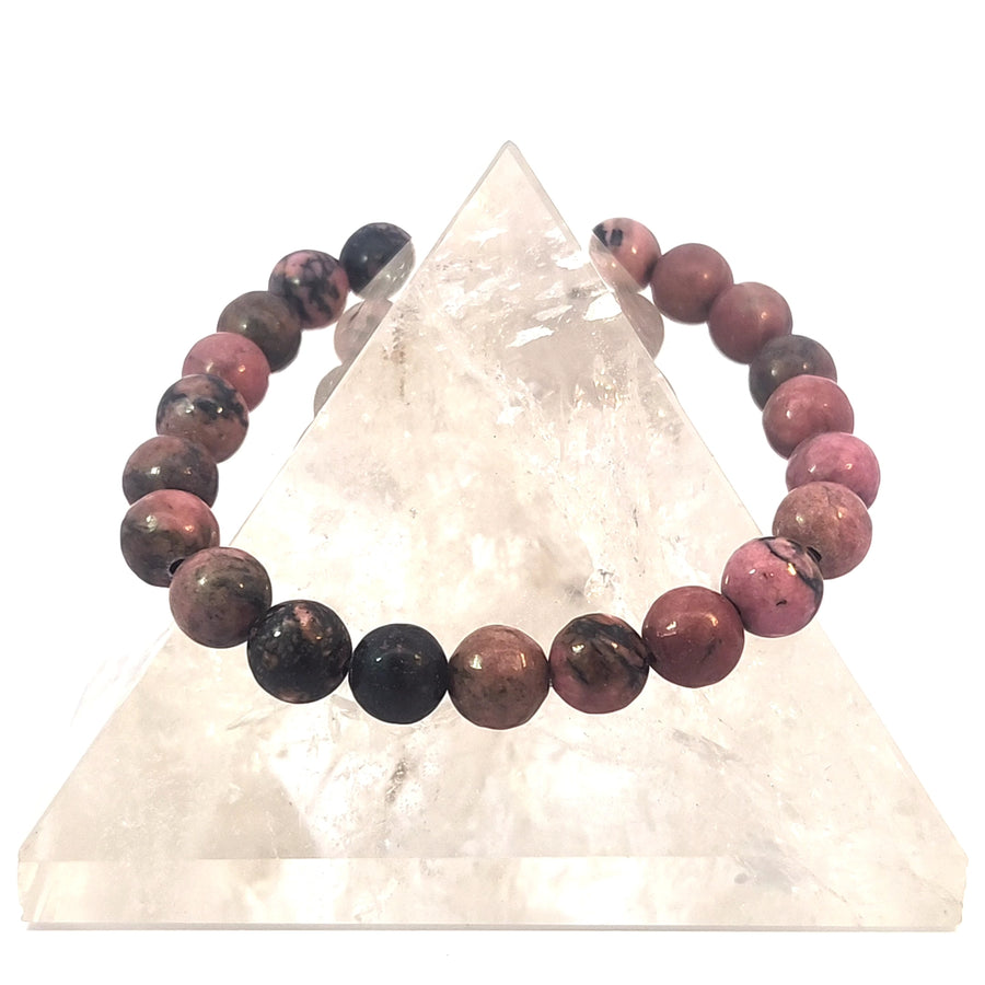 Natural Rhodonite stretch bracelet with pink and black gemstone beads.