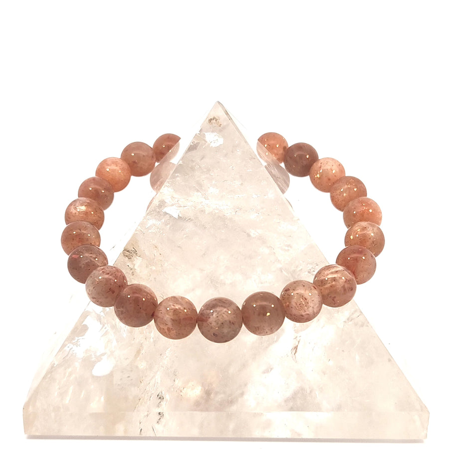 Natural golden-orange Sunstone stretch bracelet featuring polished gemstone beads.
