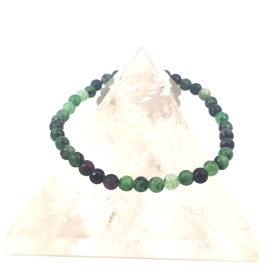 Natural Zoisite gemstone bead stretch bracelet with polished green beads on durable elastic cord for everyday wear.