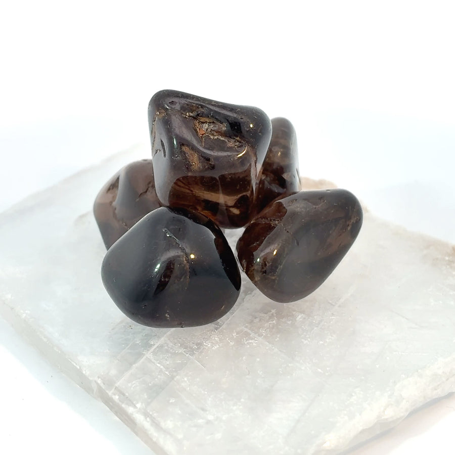 Set of 4 natural Smoky Quartz tumbled stones with polished gray-brown crystal surfaces