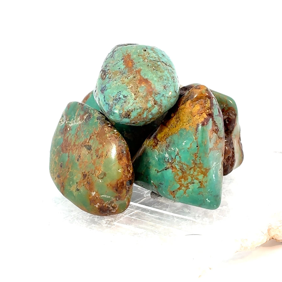 Set of 3 genuine tumbled turquoise stones with natural blue-green color and subtle matrix veining
