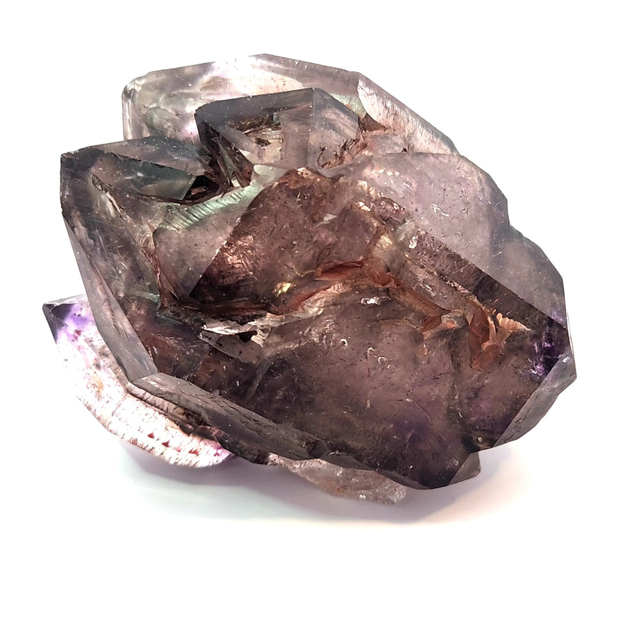 Large natural amethyst scepter crystal from Chibuku Zimbabwe with smoky amethyst head, lighter stem, hematite needle inclusions, and enhydro features weighing 224.3 grams.