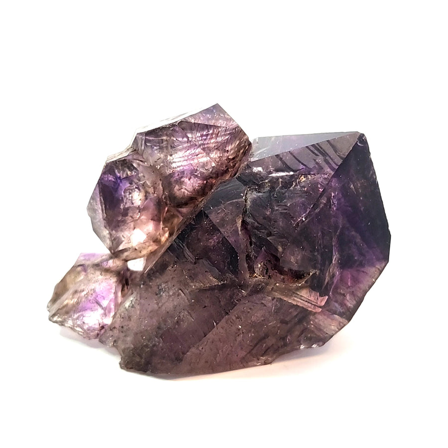 Natural amethyst scepter crystal from Chibuku Zimbabwe with smoky amethyst head, hematite needle inclusions, and enhydro features.