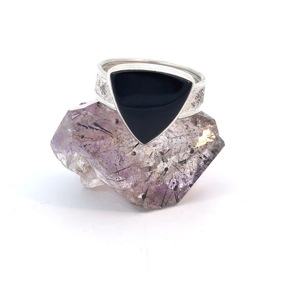 Size 11 black onyx ring with a textured artisan band featuring a polished deep black gemstone.