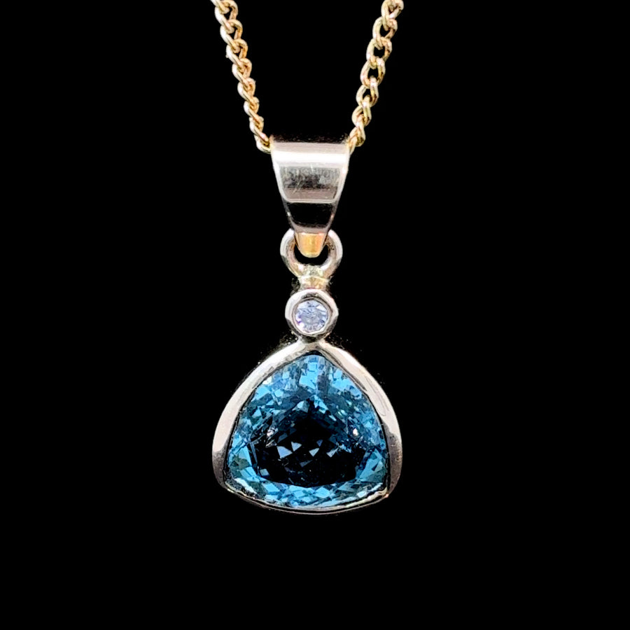 14K gold pendant with natural blue topaz and diamond accent