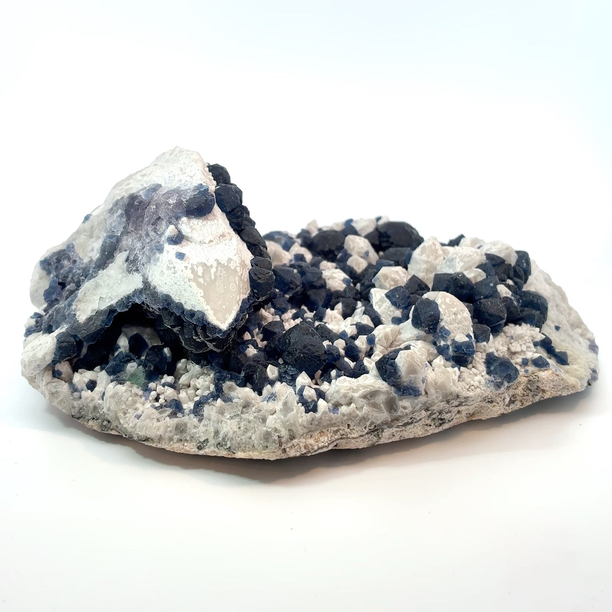 Natural blue fluorite crystals growing on white candle quartz from Inner Mongolia, collector-quality mineral specimen with vibrant blue crystal clusters.