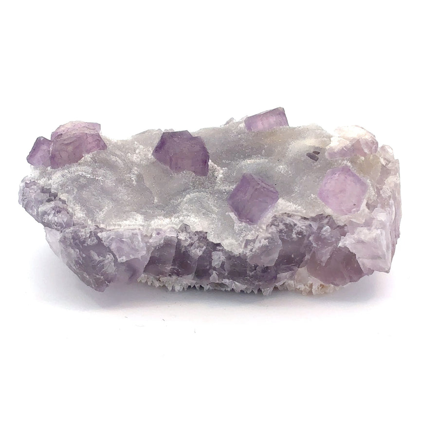 a natural purple cubic fluorite crystal on sparkling druzy quartz from China