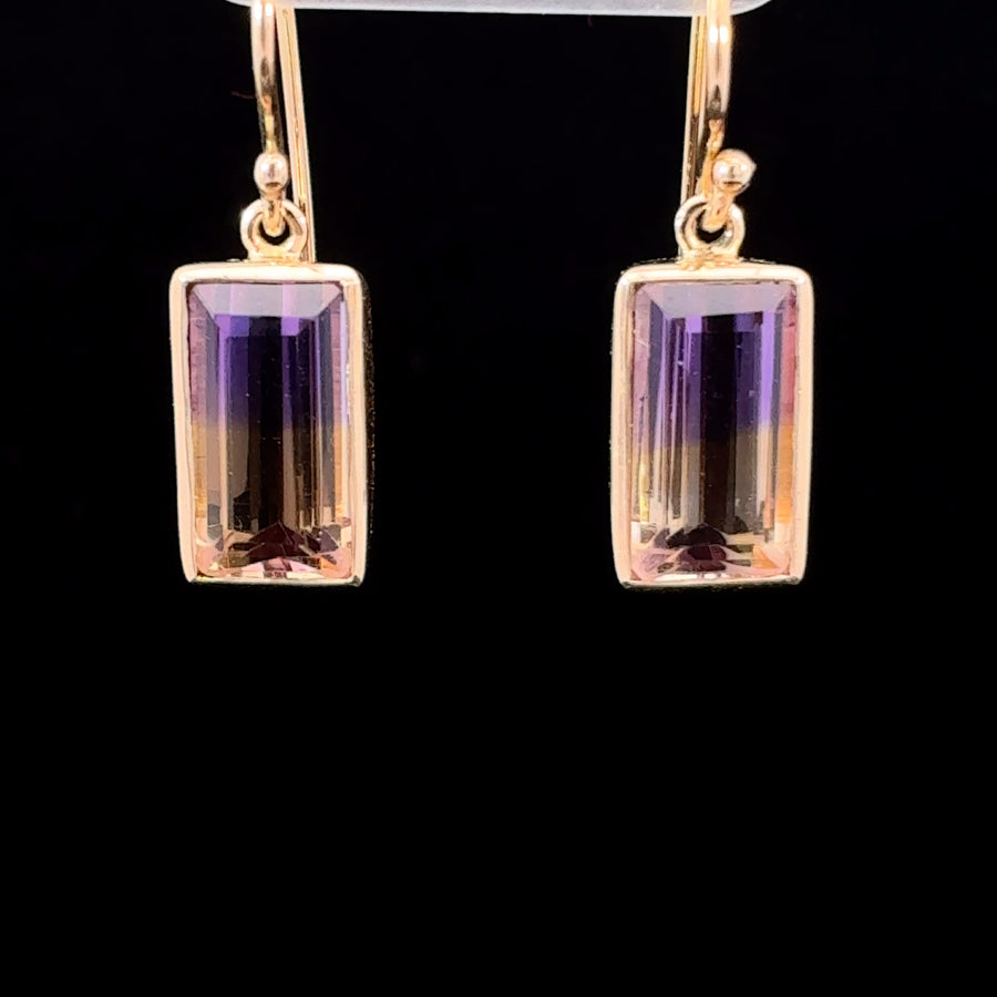 Elegant 14K gold dangle earrings featuring faceted natural ametrine quartz.