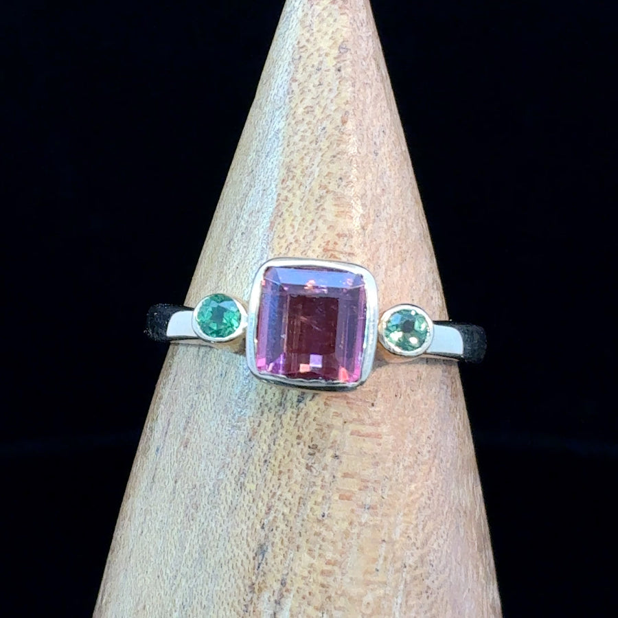 14K gold ring featuring a square-cut pink tourmaline with two green tourmaline accent stones on a minimalist band, size 6.75.