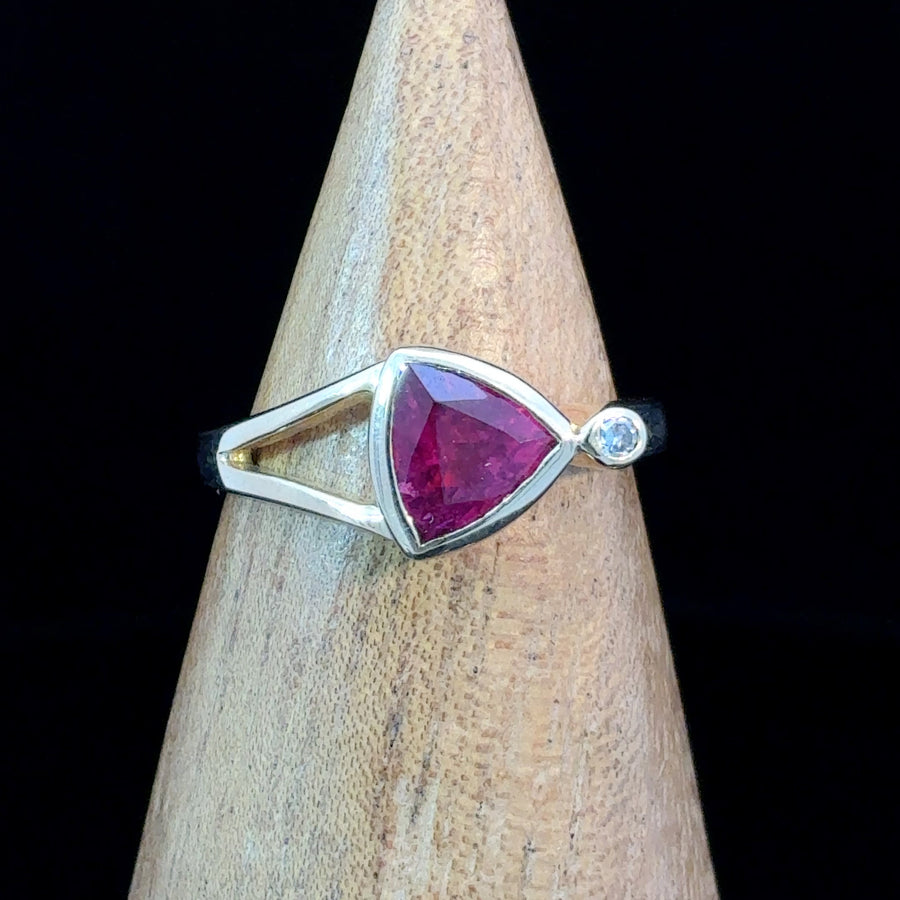 Handcrafted 14K gold ring featuring a natural triangle-cut pink tourmaline with a round diamond accent and elegant split band design, Size 7.