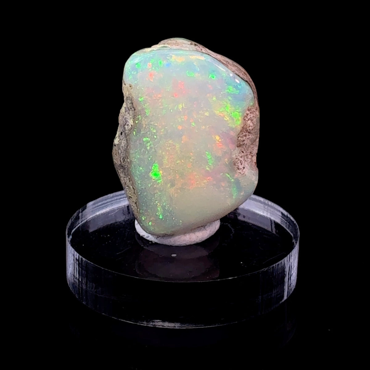 Natural Ethiopian Opal specimen with brilliant rainbow flash, multiple colorful play-of-color windows, 4.2 grams, collectible crystal mineral.