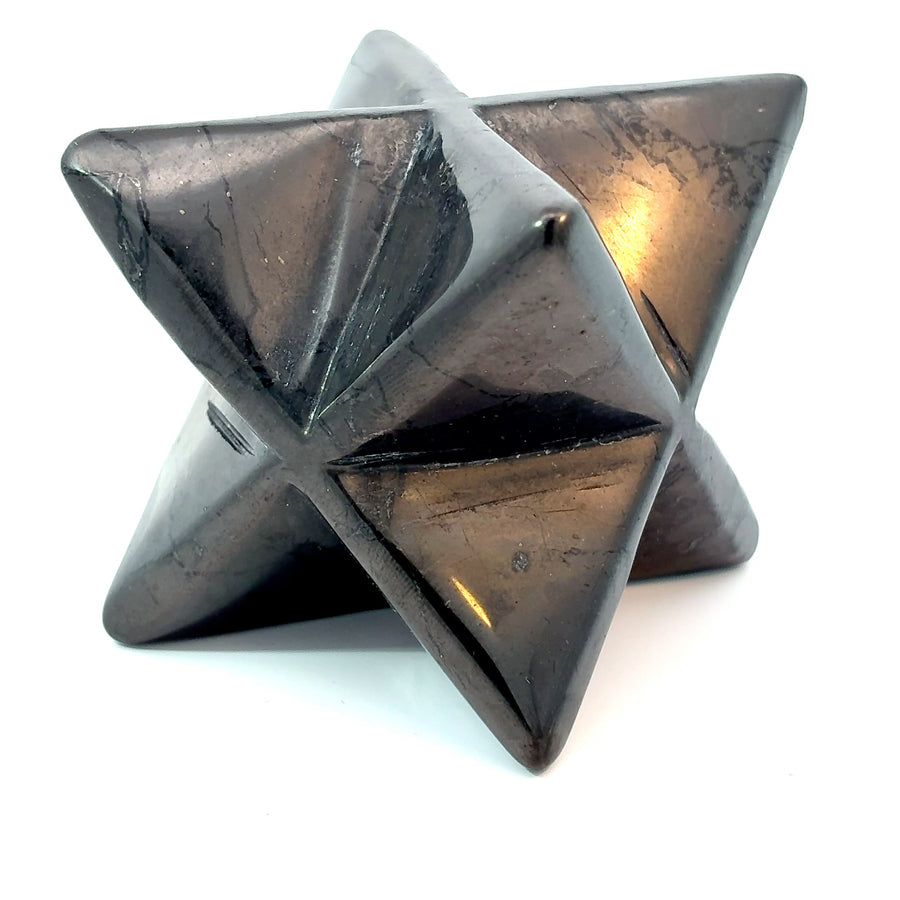 Natural 50 mm Russian Shungite Merkaba carved from genuine carbon-rich Shungite crystal for grounding, energy protection, meditation, sacred geometry, and crystal collecting.
