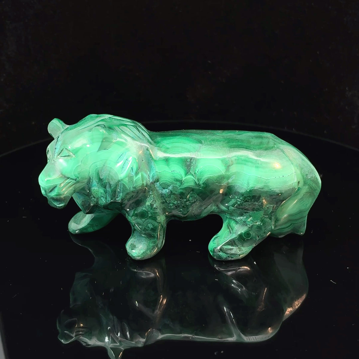 Carved malachite lion from the Democratic Republic of the Congo, natural green mineral sculpture weighing 133 grams
