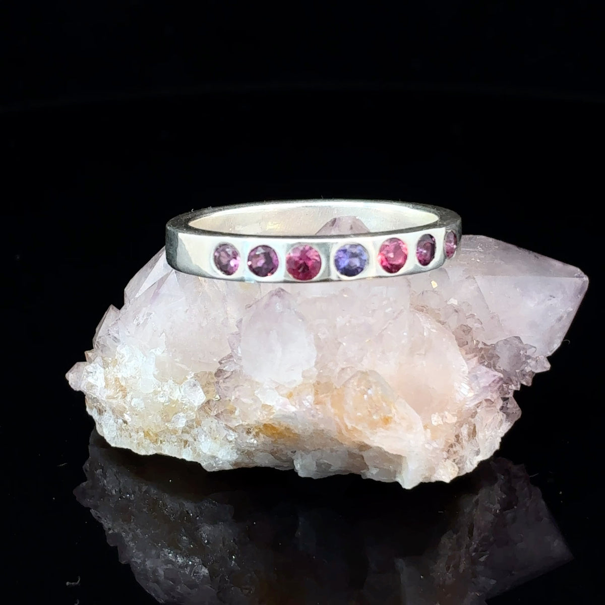 Handmade Sterling Silver band ring with center Purple Sapphire, Pink Rhodolite Garnets, and Pink-Purple Sapphires, size 9.5