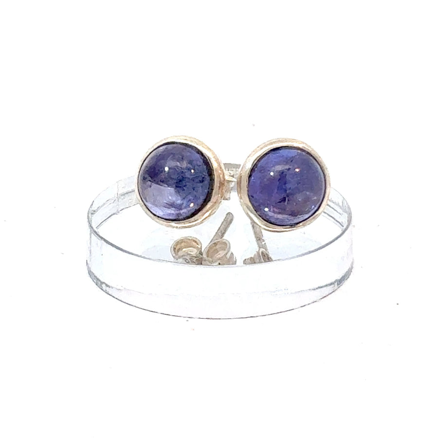 Round Tanzanite cabochon stud earrings set in sterling silver with blue-violet natural gemstone centers

